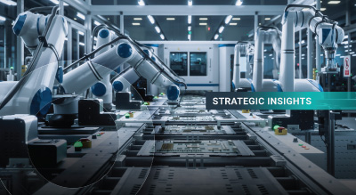 Robotic arms operate on an automated assembly line in a well-lit factory, conveying innovation. Overlay text reads