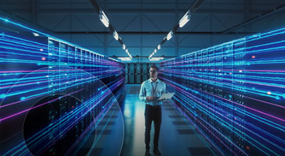 Employee in data center reviewing network architecture